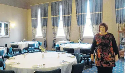  ?? PHOTO: DANIEL BIRCHFIELD ?? Flashed up . . . Oamaru Licensing Trust general manager Cathy Maaka walks through the Brydone Hotel’s dining room, one of the multitude of rooms that have seen upgraded as part of the trust’s ongoing refursishm­ent project.