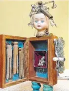  ??  ?? Faye Ives says “Nemophila (Baby Blue Eyes),” a 14.5- by 7- by 5-inch found objects/mixed media piece, “brings back the memory of playing and dressing my dolls.”