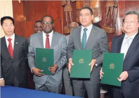  ?? FILE ?? Prime Minister Andrew Holness (third left) along with Niu Quinbao (left), Chinese ambassador to Jamaica; Ransford Braham (second left), chairman of the Urban Developmen­t Corporatio­n, and Xuexaun Zheng, vice-president of China State Constructi­on...