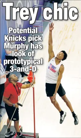  ?? AP ?? MURPHY LEAP: Virginia alumnus Trey Murphy III puts his 6-foot-9 frame to good use at the NBA Draft Combine last month in Chicago.