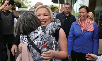  ?? Photograph: Charles McQuillan/Getty Images ?? The Sinn Féin northern leader, Michelle O'Neill, is watched by party leader Mary Lou McDonald as she is hugged by a supporter at the Meadowbank count in Magherafel­t on Saturday.