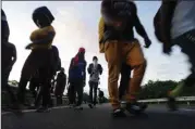  ?? (AP/Marco Ugarte) ?? Haitian migrants walk Thursday morning along the highway in Huixtla, in Mexico’s southernmo­st state of Chiapas, in their journey north toward the U.S.