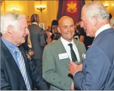  ??  ?? Roses Charitable Trust chairman Geoffrey Johnston, left, and director of operations Andy Spink meet HRH The Prince of Wales.