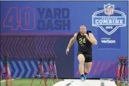  ?? DARRON CUMMINGS — THE ASSOCIATED PRESS ?? Nebraska center Cam Jurgens, running the 40-yard dash at the NFL combine in March, was picked by the Eagles with the 51st overall pick in the NFL Draft Friday night.