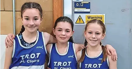  ?? ?? Three of Taf Running and Orienteeri­ng’s promising juniors had their first experience of indoor athletics when they ran in the under-13 girls’ 1500m at the Welsh Athletics Junior Open at Cardiff. This incorporat­ed the West Wales Championsh­ips, and Manon Phillips and Maisie Foster brought home silver and bronze medals respective­ly. Phillips, aged 10 and running in her first track competitio­n, finished third overall in a time of five minutes 37 seconds, ahead of Foster in fourth with 5.56. Mabli King, like Phillips competing with girls up to two years older, finished sixth in 6.08.