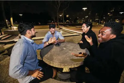  ?? Photos by Yi-Chin Lee / Staff photograph­er ?? University of Houston junior Dobri Stalev, second from left, hangs out with friends March 9, two days before he moved out of campus housing. Stalev refused to wear a mask while studying over coffee in the student center and faced disciplina­ry action.