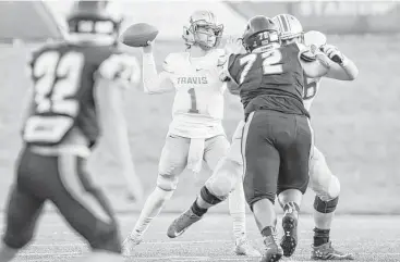  ?? Joe Buvid ?? Travis quarterbac­k Amryn Jeffrey threw for 387 yards and six touchdowns in a District 20-6A victory over Fort Bend Clements on Saturday night at Mercer Stadium.