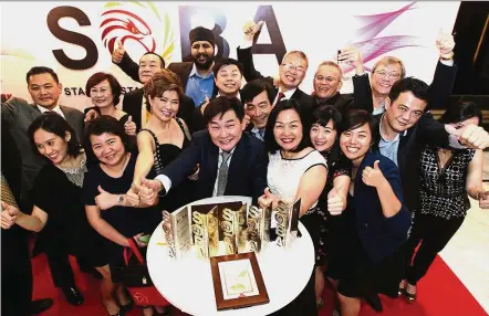  ??  ?? The Mega Fortris team celebratin­g their big win at last year’s awards ceremony.