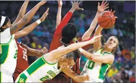  ?? John Locher Associated Press ?? OREGON’S Sabrina Ionescu, right, and Erin Boley (21) battle for a rebound against Stanford during the final of the Pac-12 women’s basketball tournament.