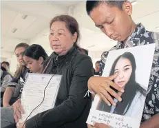  ?? TAWATCHAI KEMGUMNERD ?? The Tarawan family waits at the Public Health Ministry to file a petition against a hospital which allegedly denied treatment to Chorlada Tarawan.