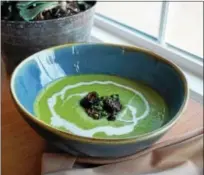  ?? PHOTO BY EMILY RYAN ?? EatNic’s spring pea soup features mint, morels and creme fraiche.