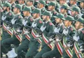  ?? AGENCIES ?? ■ IRGC members (top) at a parade in Tehran; an anti-US banner (left) at a rally in Peshawar, Pakistan.