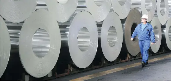  ?? SEAN GALLUP/GETTY IMAGES FILES ?? Following a steep decline in U.S. smelting capacity, the U.S. tariffs are unlikely to deliver a blow to Canadian producers, which supply 47 per cent of the aluminum consumed in the U.S., analysts say. “There’s no way the U.S. is or can be...