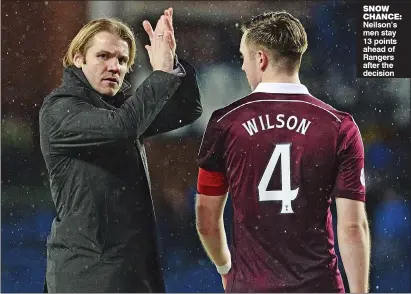  ??  ?? SNOW CHANCE: Neilson’s men stay 13 points ahead of Rangers after the decision