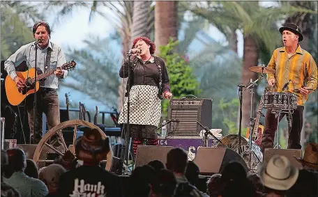  ?? FRAZER HARRISON/GETTY IMAGES/TNS ?? From left, musicians John Doe, Exene Cervenka, and DJ Bonebrake performed as The Knitters at 2009’s Stagecoach Country Music Festival in Indio, California. They are now back together in the band X.