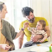  ??  ?? Tat Read and Joe Callaghan share a meal with baby Ro.