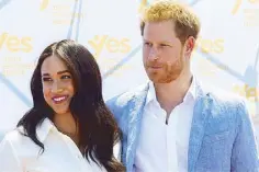  ?? REUTERS ?? Britain’s Prince Harry and his wife Meghan visit a township in Johannesbu­rg, South Africa on Friday.