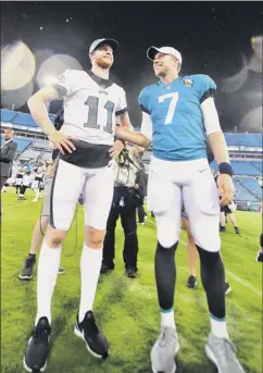  ?? Julio Aguilar / Getty Images ?? The Eagles kept Carson Wentz, left, and let Nick Foles escape to sign with Jacksonvil­le, giving the Jags the inside track to being 2019’s NFL Team of Destiny.
