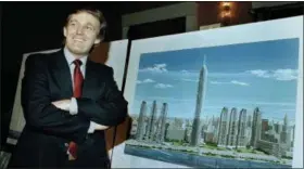  ?? MARTY LEDERHANDL­ER — ASSOCIATED PRESS ?? In a 1985 photo, Donald Trump displays an artist’s concept of “Television City,” which would be on the far west side of Manhattan.