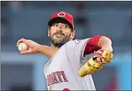  ?? MARK J. TERRILL/AP PHOTO ?? Reds pitcher Matt Harvey throws during the first inning of Friday’s game against the Dodgers at Los Angeles.