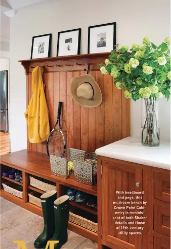  ??  ?? With beadboard and pegs, this mudroom bench by Crown Point Cabinetry is reminiscen­t of both Shaker details and those of 19th-century utility spaces.