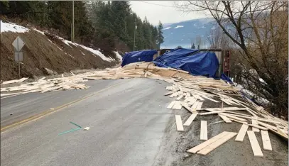  ?? RCMP ?? Lumber spill closed Highway 97A, near the junction of Highway 97B for hours Tuesday near Grindrod.