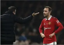  ?? (AP/Leila Coker) ?? Manchester United midfielder Christian Eriksen (right) speaks with Fulham Coach Marco Silva following the club’s 2-1 victory on Sunday at the Craven Cottage stadium in London. Following the win, Eriksen and teammate Bruno Fernandes voiced their concerns about Qatar hosting the World Cup, highlighti­ng the timing of the tournament and the country’s “treatment of migrant workers.”