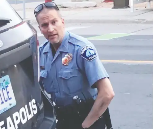  ?? Darnela Fra zier via Facebook / AFP via Gety Images ?? This still image taken from a video shows Minneapoli­s police officer Derek Chauvin during the arrest of George Floyd. Chauvin has been charged in the wake of Floyd’s fatal arrest that sparked protests and rioting.