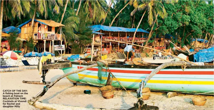  ??  ?? CATCH OF THE DAY: A fishing boat on the beach at Patnem RELAXATION TIME: Cocktails at Vivendi for Rachel and daughter Milly