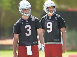  ??  ?? Cardinals quarterbac­ks Josh Rosen, left, and Sam Bradford take part in Organized Team Activities on May 15 in Tempe.