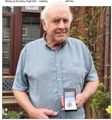  ??  ?? Hugh McGinn snr at home in Hardmans Gardens with his new Cardinal O’Donnell Cup medal, which he earned back in 1973.