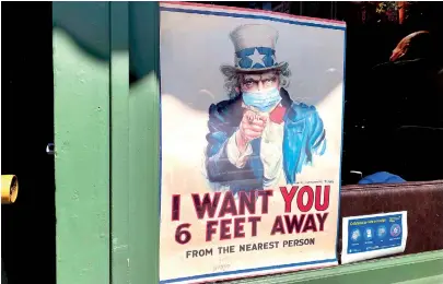  ??  ?? The iconic “I Want You for US Army” Uncle Sam poster in pandemic times. (AFP)