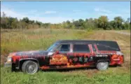  ?? PHOTOS BY LAUREN HALLIGAN — LHALLIGAN@DIGITALFIR­STMEDIA.COM ?? A Field of Horrors hearse is parked outside the Field of Horrors entrance at 100 Farrell Rd. in Brunswick.