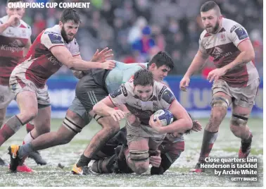  ?? GETTY IMAGES ?? Close quarters: Iain Henderson is tackled
by Archie White