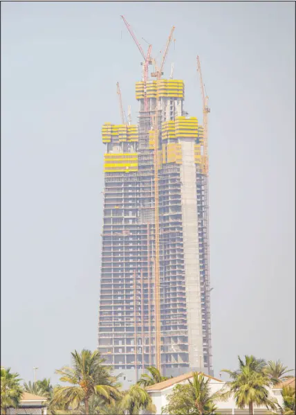  ?? SHUTTERSTO­CK ?? Idle cranes sit atop the stalled Jeddah Tower in Jeddah, Saudi Arabia. When the project was announced in 2008, plans called for it to be more than 500 feet taller than Dubai’s Burj Khalifa, which tops 2,700 feet and is the world’s tallest building. But since a 2017 anti-corruption purge in Saudi Arabia that started when Crown Prince Mohammed bin Salman came to power, the site has remained quiet. Now, the crown prince has his own plans for Jeddah.