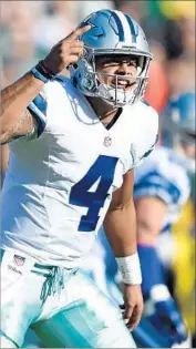  ?? Hannah Foslien Getty Images ?? DAK PRESCOTT has done a remarkable job in place of the injured Tony Romo, and the Cowboys have a big decision to make when Romo returns.