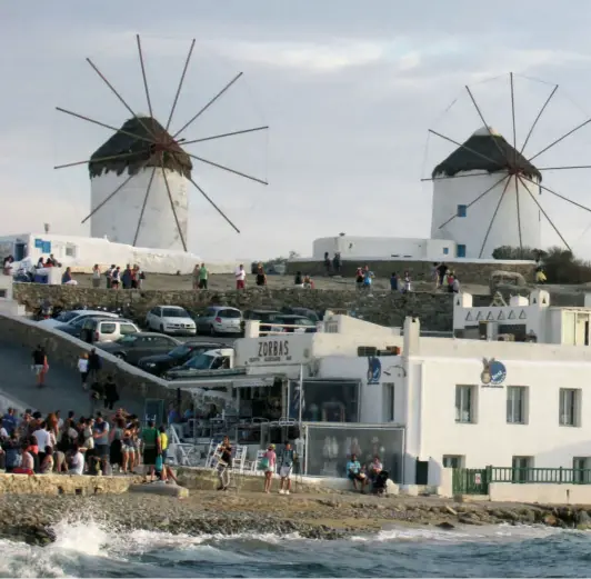  ??  ?? THE FAMED WINDMILLS of Mykonos’ capital, Hora. They date back to the 16th century and were once used to grind grain.