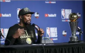  ?? CARLOS OSORIO — THE ASSOCIATED PRESS ?? Golden State Warriors forward Kevin Durant speaks during a news conference following Game 4 of basketball’s NBA Finals early Saturday in Cleveland. The Warriors defeated the Cavaliers 108-85 to take the title. Durant was named MVP of the finals.