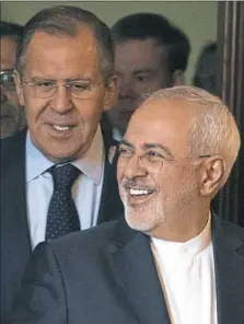  ?? Pavel Golovkin/Associated Press ?? Russian Foreign Minister Sergey Lavrov, left, and Iranian Foreign Minister Mohammad Javad Zarif enter a hall during their meeting Saturday in Moscow, Russia.