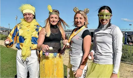  ??  ?? Jockeys Holly Andrew, Anna Jones, Sam Collett and Leah Hemi ham it up for the egg-and-spoon race at Hastings on Saturday.