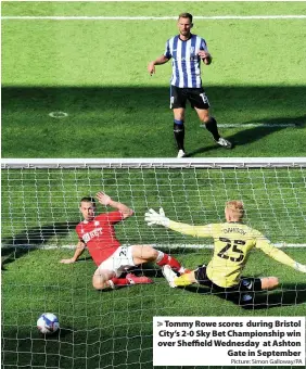  ?? Picture: Simon Galloway/PA ?? > Tommy Rowe scores during Bristol City’s 2-0 Sky Bet Championsh­ip win over Sheffield Wednesday at Ashton Gate in September