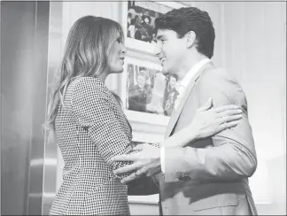  ?? NATHAN DENETTE / THE CANADIAN PRESS VIA AP ?? Prime Minister Justin Trudeau welcomes United States first lady Melania Trump on Saturday prior to the opening ceremonies of the Invictus Games in Toronto.