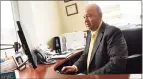  ?? Tyler Sizemore / Hearst Connecticu­t Media ?? Branch Manager Camilo Duque Jr. works in his office at the First County Bank branch in Stamford on July 8.