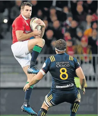  ?? Picture: AFP ?? SERIOUS BUSINESS: British and Irish Lions’ Jared Payne, left, jumps for the ball against Otago Highlander­s’ captain Luke Whitelock during their match at the Forsyth Barr Stadium in Dunedin yesterday