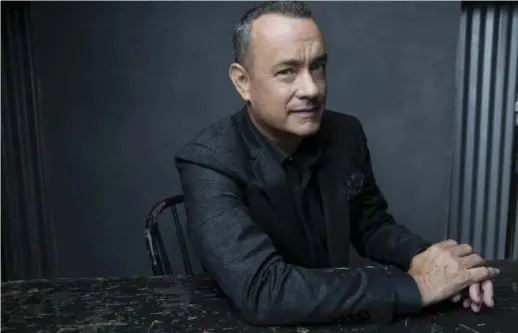  ?? AUSTIN HARGRAVE ?? Tom Hanks says the late screenwrit­er Nora Ephron, who directed him in You’ve Got Mail and Sleepless in Seattle, was the one who first really encouraged him to write.