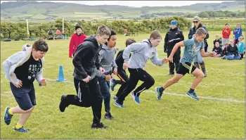  ??  ?? The boys’ marathon winner, Lewis Gilchrist, right, got off to a flying start. 50_c25ruralsp­orts14