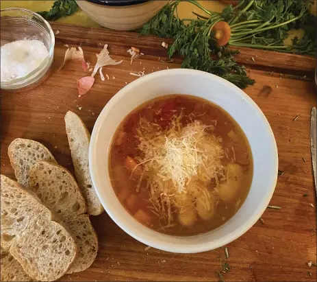  ?? JACK BENNETT — TNS ?? Serve Bradley Sweek’s Best-Ever Beans with lots of grated Parm, some good bread and a simple salad for dinner-partyworth­y greatness.