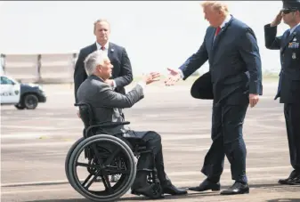  ?? Doug Mills / New York Times ?? President Trump is greeted by Gov. Greg Abbott upon arrival in Houston. Reporters were not permitted at the meeting between Trump and the families of a high school shooting victims.