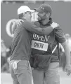  ?? AP Photo/Alastair Grant ?? n Jordan Spieth of the United States celebrates with his caddie Michael Greiler after winning the British Open Golf Championsh­ip on Sunday at Royal Birkdale, Southport, England.