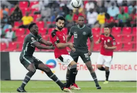  ?? ?? Mohamed Salah of Egypt is challenged by Kenneth Omeruo of Nigeria during the 2021 Afcon match on 11 January 2022. Photo: Samuel Shivambu/BackpagePi­x